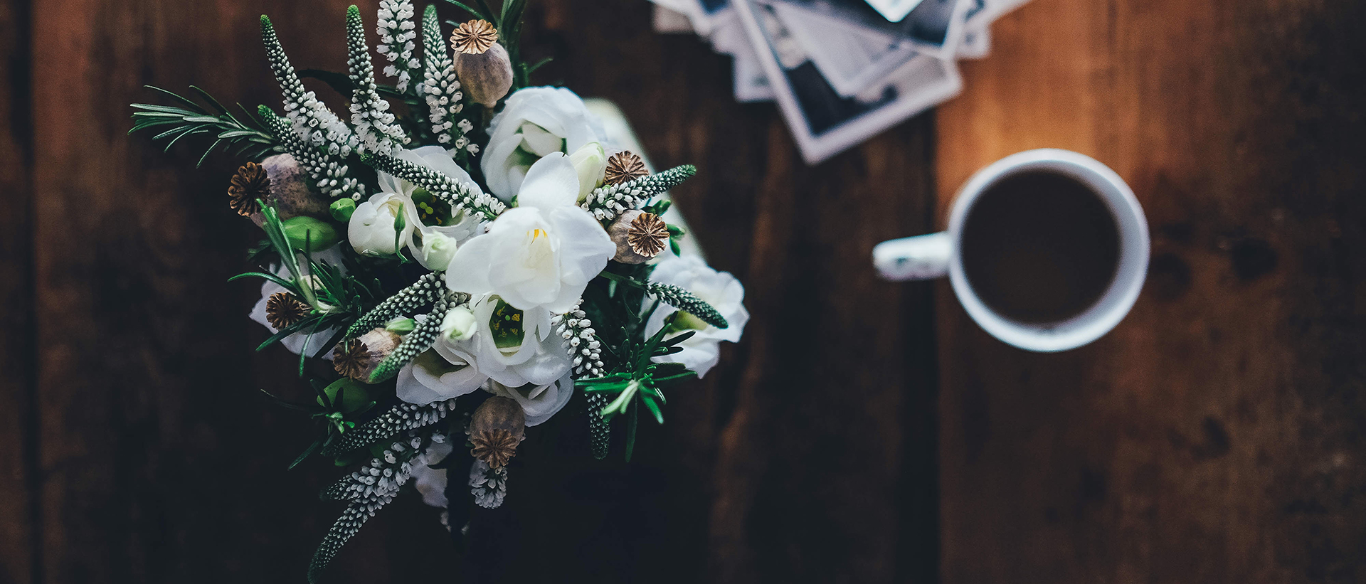 Table with flowers and a cup of coffee